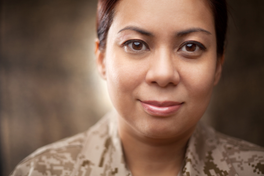 African-American woman dressed in army fatigues.